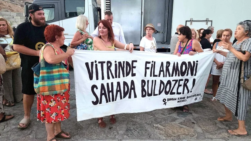 BODRUMLU KADINLARDAN LİMAK’IN 50.YIL KONSERİNE PROTESTO,, “Vitrinde filarmoni, sahada buldozer: Kurumsal ikiyüzlülüğün Akbelen resmi.”
